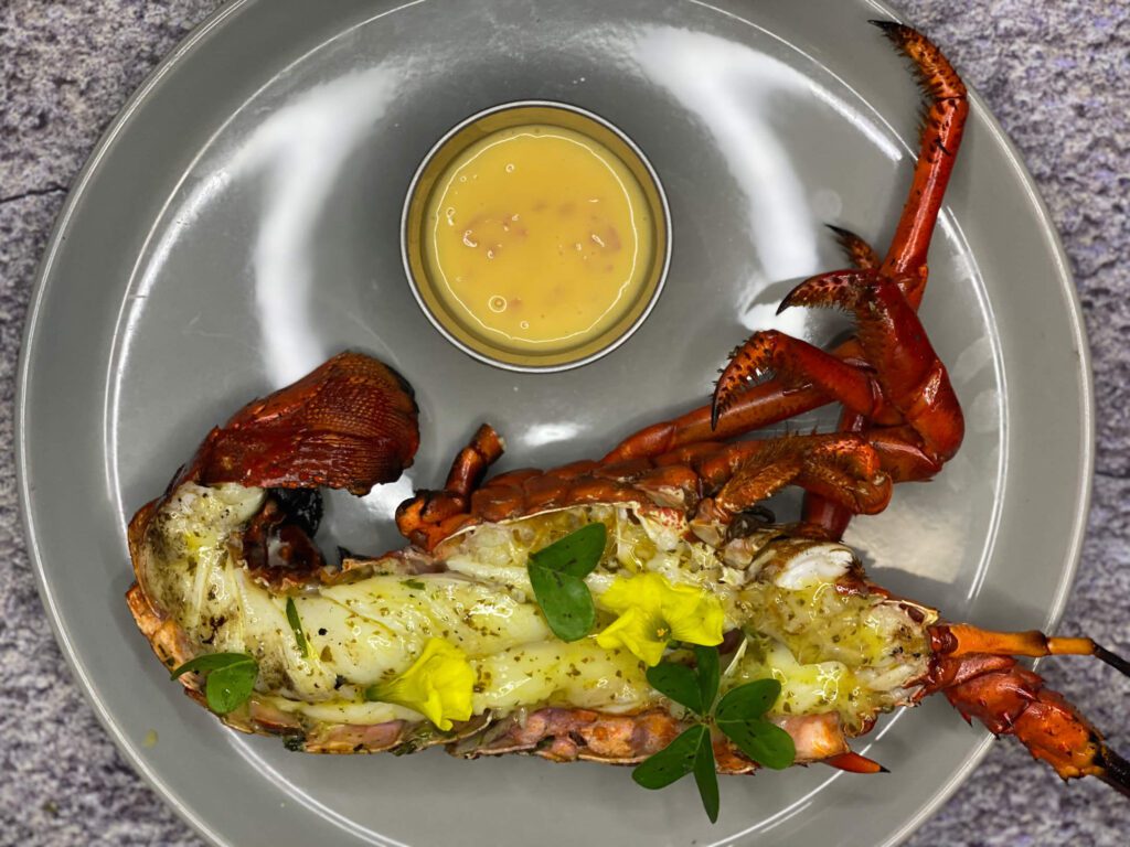 Grilled Spiny Lobster in Wild Wood Sorrel Compound Butter with Beurre Blanc