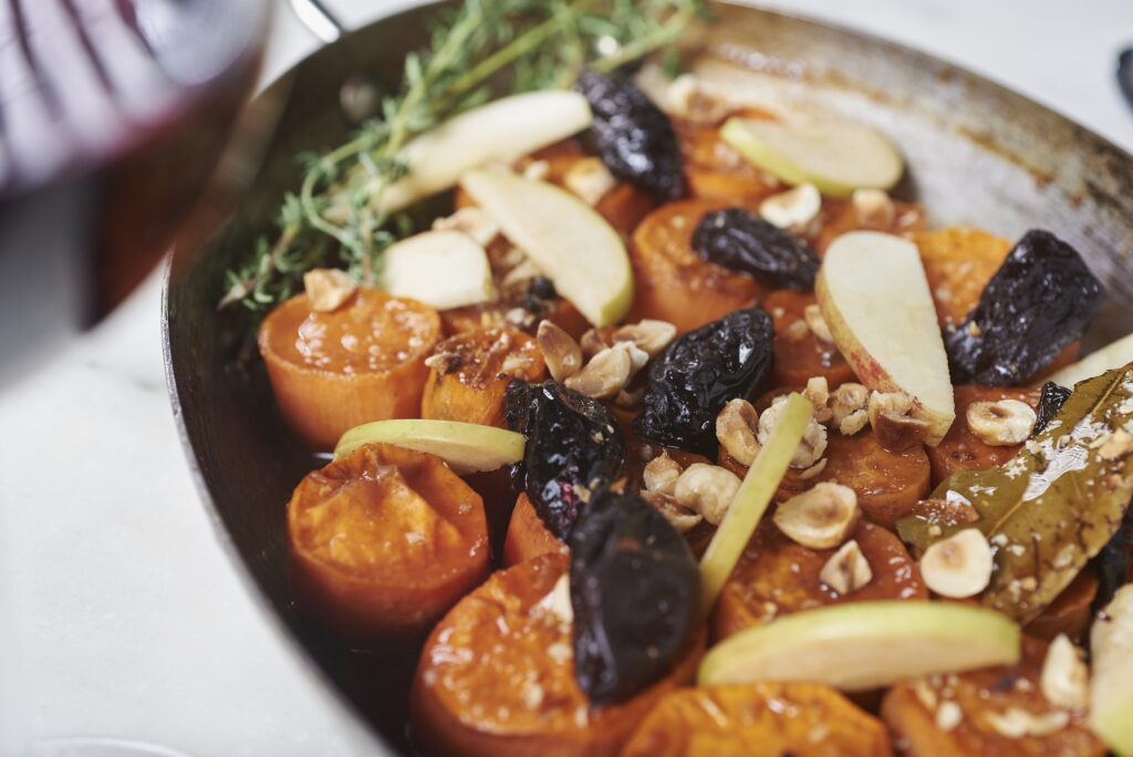 Apple Cider-Braised Sweet Potatoes with Calvados Prunes and Hazelnuts